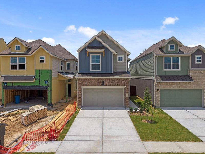 Front exterior of a new home in Meridiana Chateau, Manvel, TX, highlighting curb appeal (Image 2). Front exterior of a new home in Meridiana Chateau, Manvel, TX, highlighting curb appeal (Image 2).