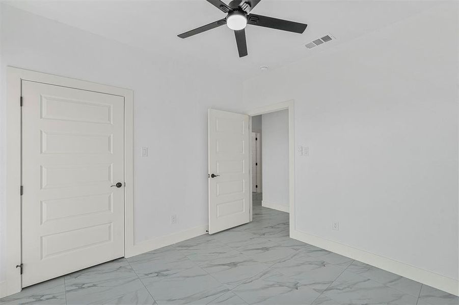 Unfurnished bedroom with ceiling fan