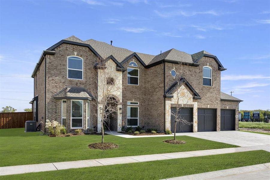 Front exterior of a new home in Polo Ridge, Mesquite, TX, highlighting curb appeal (Image 18). Front exterior of a new home in Polo Ridge, Mesquite, TX, highlighting curb appeal (Image 18).