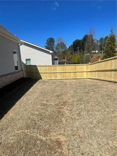 Exterior details and patio area of a home in Courtyards at Traditions, Cumming (Image 24).