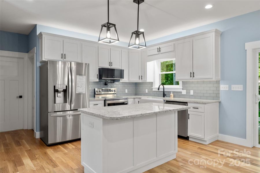 So many extras in this custom kitchen with it's mood lighting and pot filler