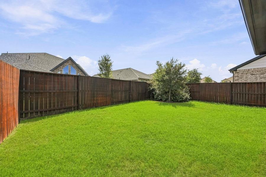 Exterior details and patio area of a home in Meridiana, Iowa Colony (Image 22).