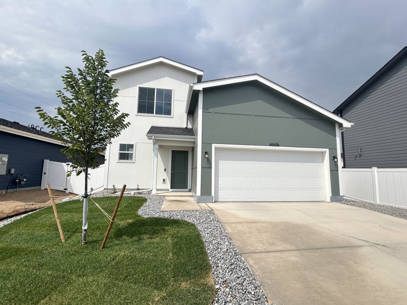 Front exterior of a new home in Liberty Draw, Evans, CO, highlighting curb appeal (Image 2). Front exterior of a new home in Liberty Draw, Evans, CO, highlighting curb appeal (Image 2).