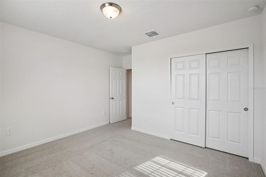 Spacious, unfurnished interior of a new home in Villamar - Signature Series, Winter Haven (Image 17).