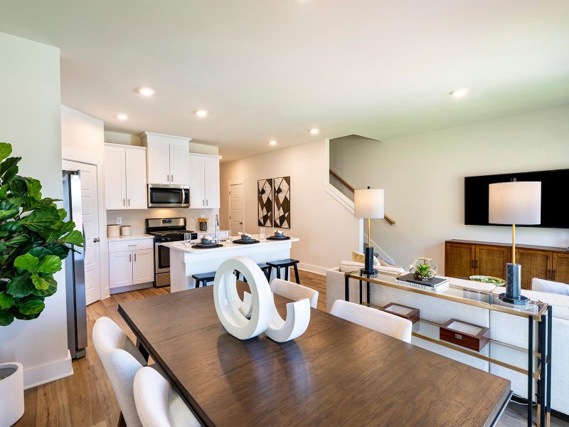 Enjoy your morning coffee at the stunning dining room table. Photography from City Station Townes. Enjoy your morning coffee at the stunning dining room table. Photography from City Station Townes.