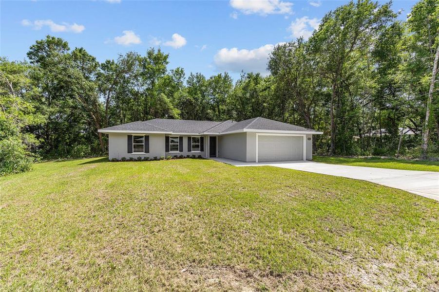 Front exterior of a new home in , Ocala, FL, highlighting curb appeal (Image 20).