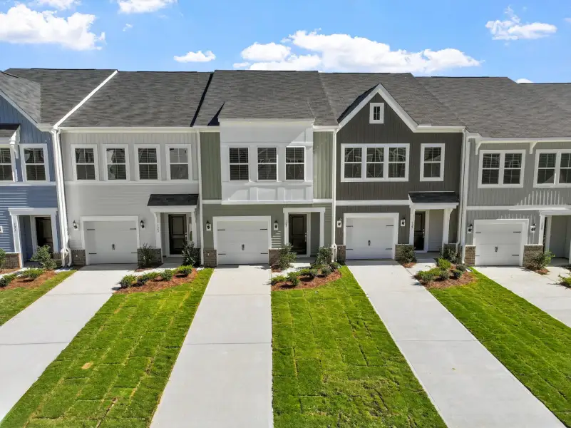 Front exterior of a new home in West Main Townhomes, Sanford, NC, highlighting curb appeal (Image 1). Front exterior of a new home in West Main Townhomes, Sanford, NC, highlighting curb appeal (Image 1).