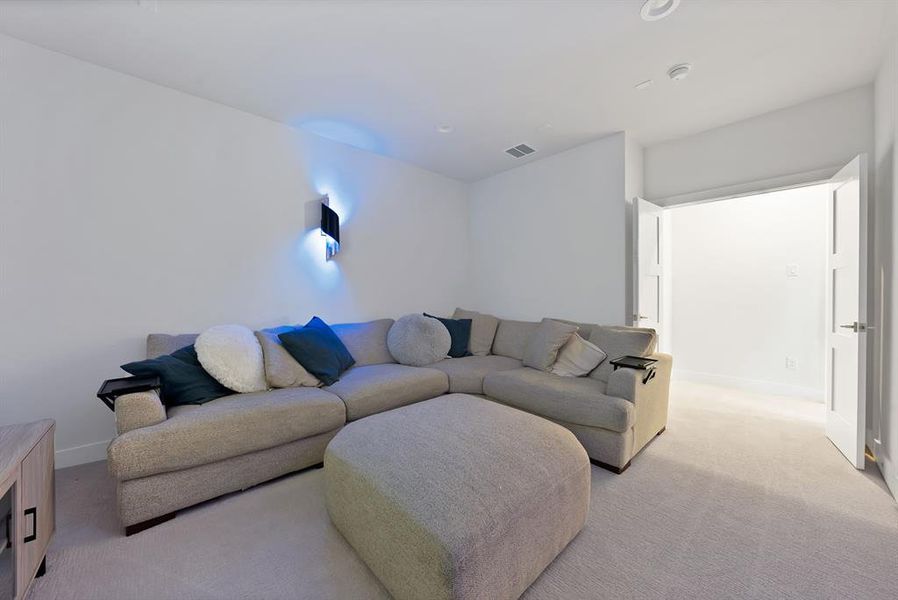 Recessed lighting in a room featuring carpet flooring and white walls Recessed lighting in a room featuring carpet flooring and white walls