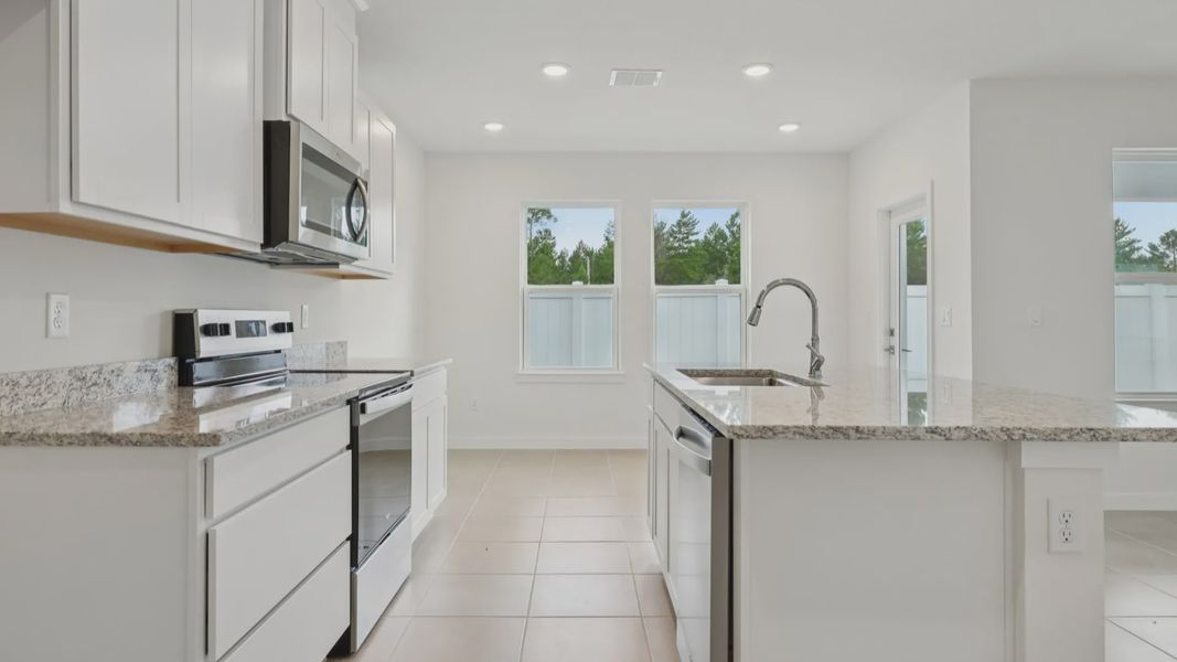 Kitchen of the Coronado - End at Cyrene at Harmony located in St Cloud FL by DRB Homes