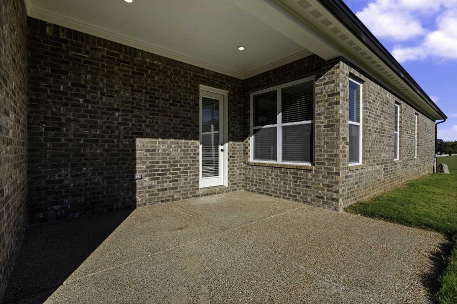 Covered patio with an exposed aggregate concrete surface