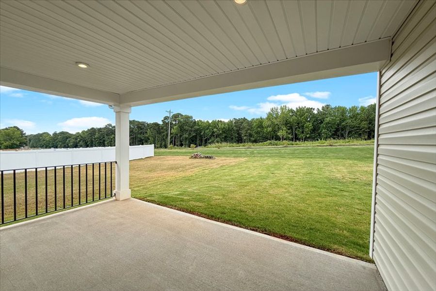 Exterior details and patio area of a home in Wren Woods 2-Story, Gray Court (Image 2).