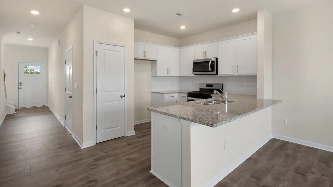 Furnished interior view inside a new home in Clock Road Townhomes, New Bern (Image 8). Furnished interior view inside a new home in Clock Road Townhomes, New Bern (Image 8).