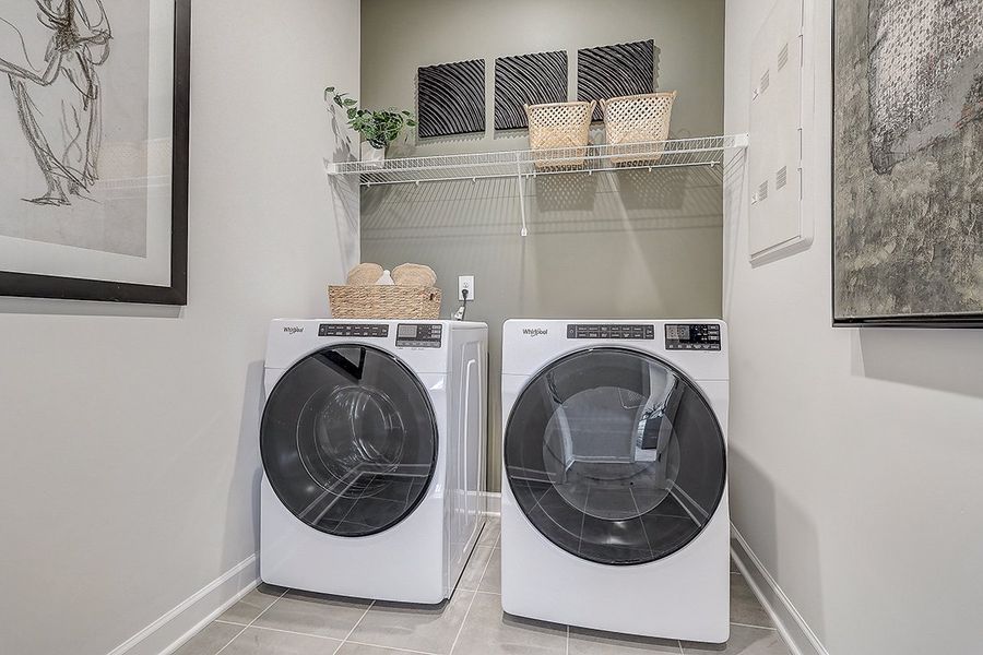 A washing machine in a room.