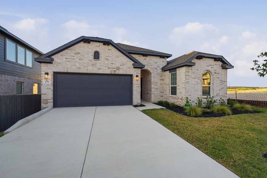 Front exterior of a new home in The Woodlands at Medina Hills, Mico, TX, highlighting curb appeal (Image 2).