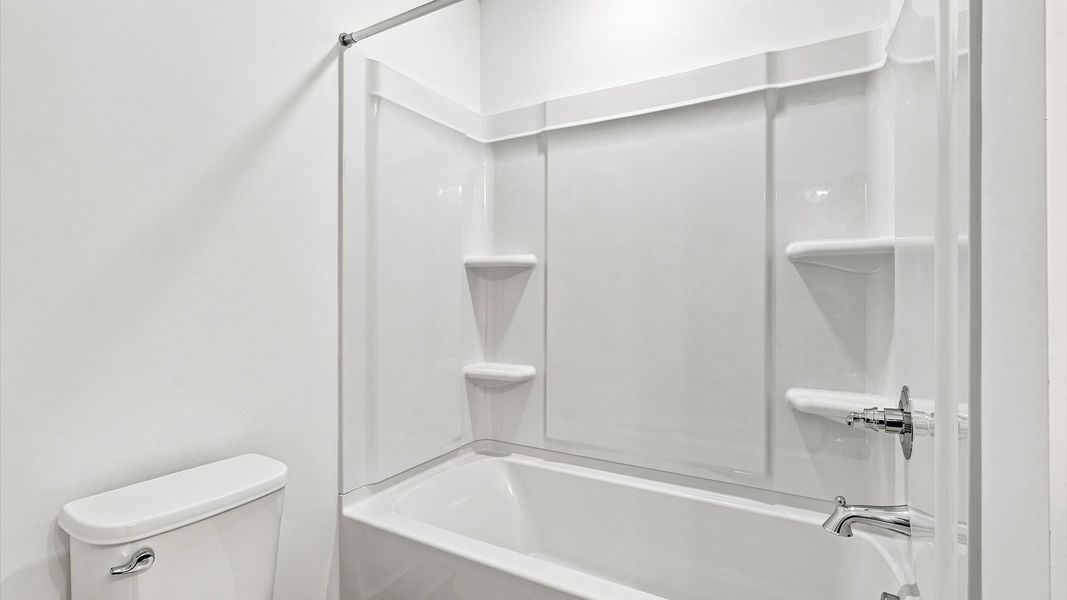 Highly skilled design seen in this polished and practical full bathroom by DRB Homes Highly skilled design seen in this polished and practical full bathroom by DRB Homes