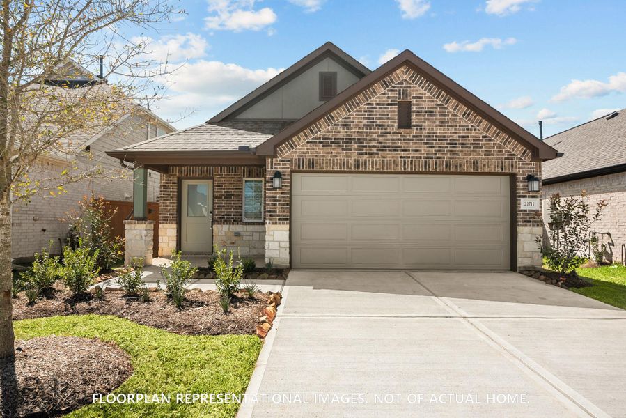 Front exterior of a new home in Lone Star Landing, Montgomery, TX, highlighting curb appeal (Image 1).