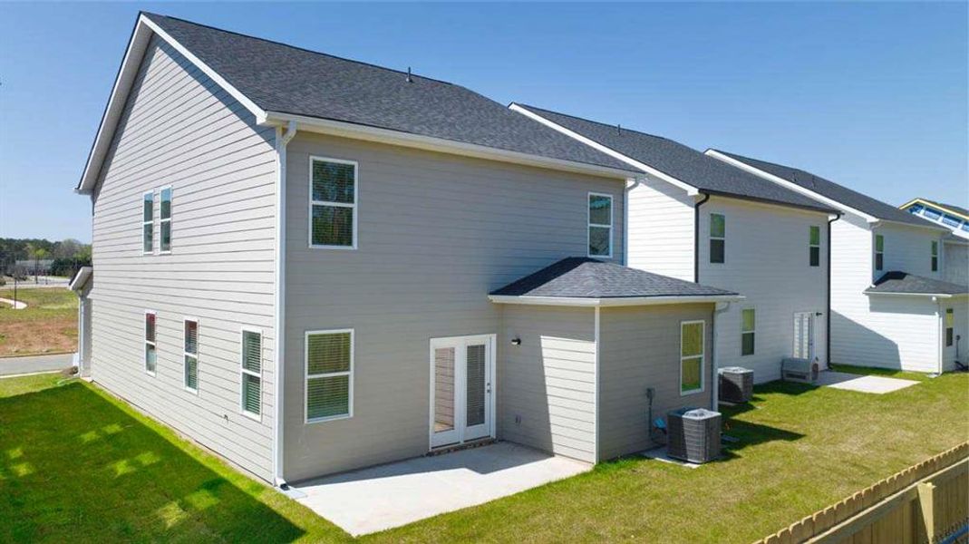 Front exterior of a new home in Shoal Creek, Hampton, GA, highlighting curb appeal (Image 14).