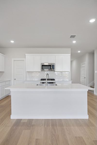 Kitchen in the Masters home plan by Trophy Signature Homes – REPRESENTATIVE PHOTO