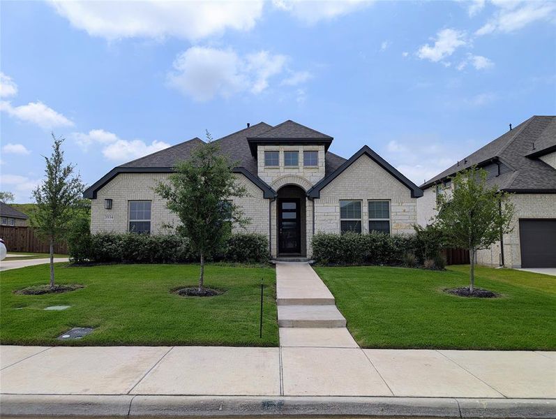 Front exterior of a new home in Westside Preserve Classic, Midlothian, TX, highlighting curb appeal (Image 2). Front exterior of a new home in Westside Preserve Classic, Midlothian, TX, highlighting curb appeal (Image 2).