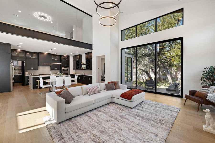 Inside, soaring ceilings, abundant natural light, and a sophisticated great room open floor plan create a backdrop for effortless entertaining and everyday comfort.