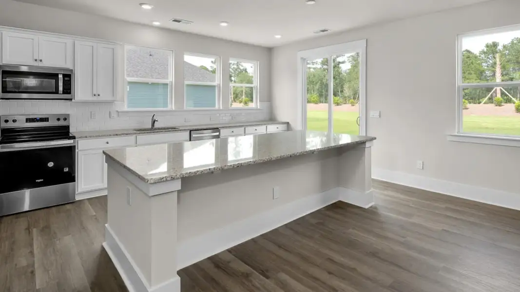 Representative furnished interior of a home built from the Forrester by D.R. Horton in The Highlands at Cedar Hill Landing, Navassa (Image 7).