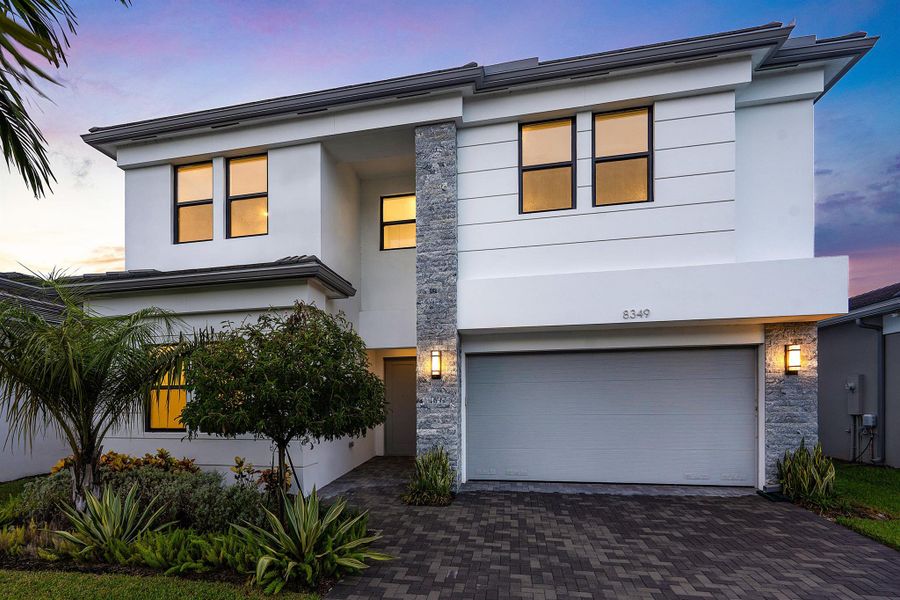 Front exterior of a new home in Lotus Edge, Boca Raton, FL, highlighting curb appeal (Image 43).