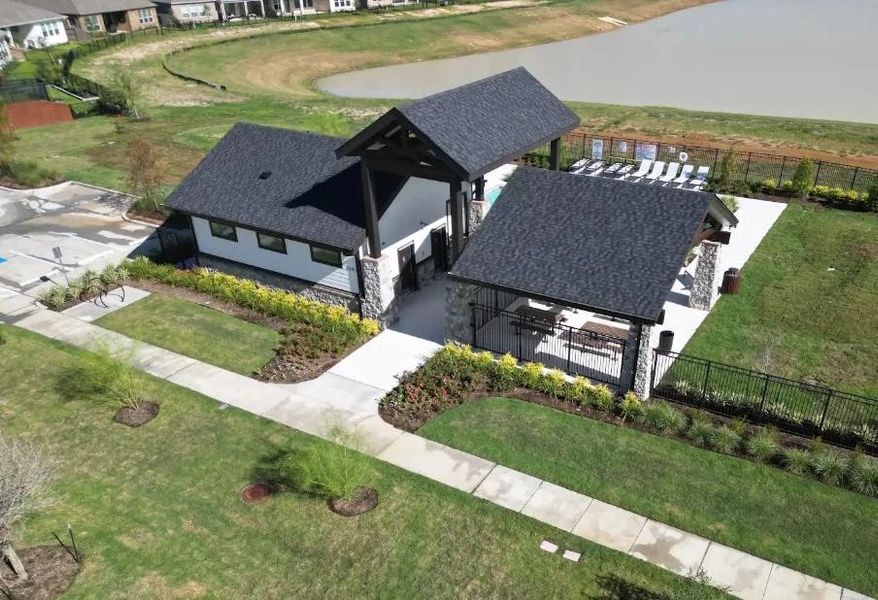 An aerial view of the pool house equipment with washrooms and a covered picnic table area.