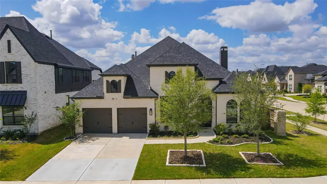 1 story Highland Homes with a dark shingle roof and a two-car garage. The front yard is well-maintained, featuring trees and landscaped flower beds. It's located in Cross Creek West neighborhood with similar-style homes. 1 story Highland Homes with a dark shingle roof and a two-car garage. The front yard is well-maintained, featuring trees and landscaped flower beds. It's located in Cross Creek West neighborhood with similar-style homes.