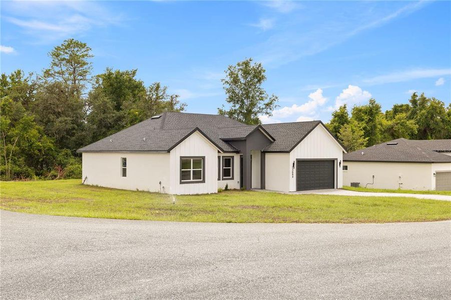 Front exterior of a new home in , Ocala, FL, highlighting curb appeal (Image 26). Front exterior of a new home in , Ocala, FL, highlighting curb appeal (Image 26).