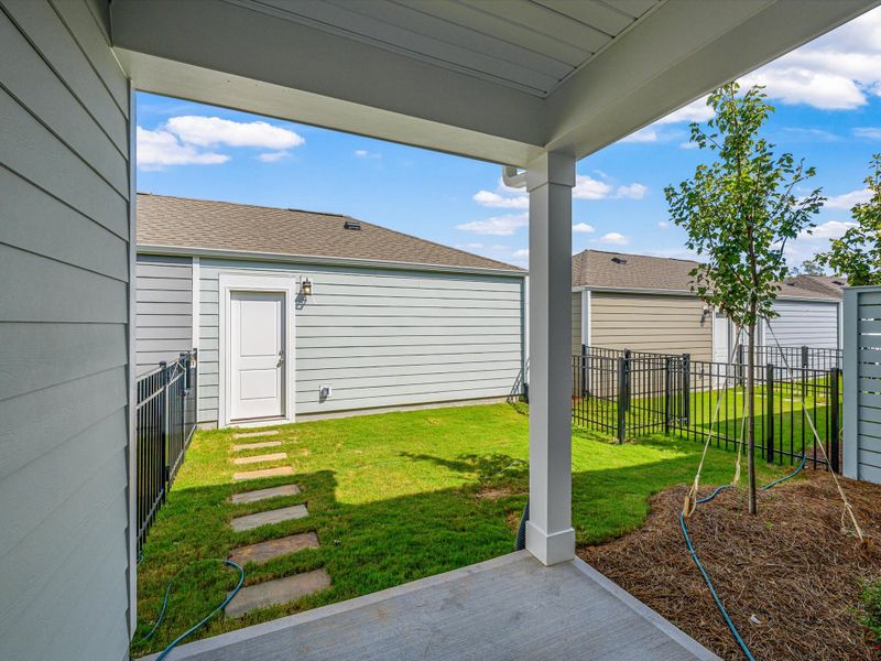 Exterior details and patio area of a home in North Creek Village - Townhomes, Huntersville (Image 4).