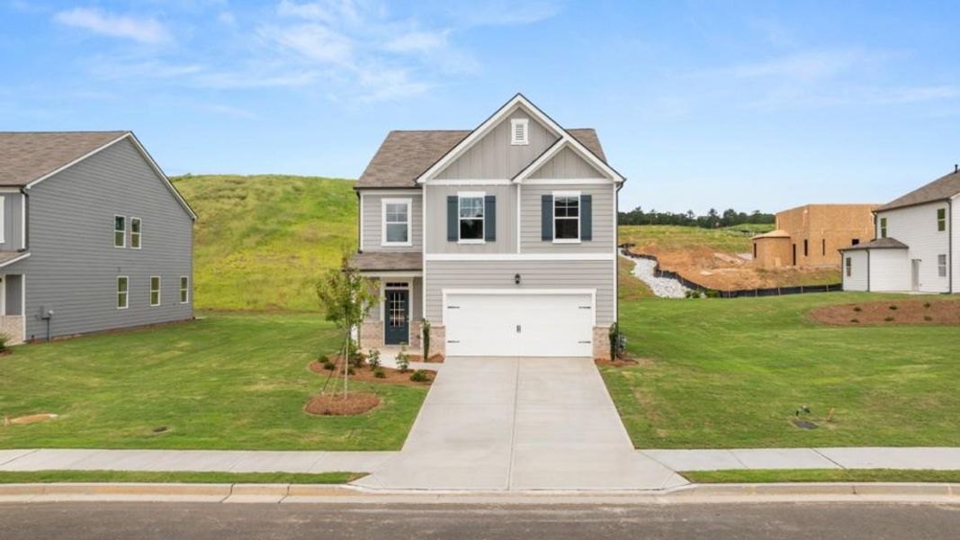 Front exterior of a new home in Sheffield Highlands, Dallas, GA, highlighting curb appeal (Image 17).