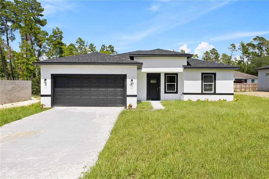 Front exterior of a new home in , Ocala, FL, highlighting curb appeal (Image 17).