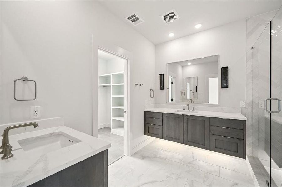 Featuring beautiful floating vanities and the perfect amount of space for two, this owner's bath is a dream come true! Featuring beautiful floating vanities and the perfect amount of space for two, this owner's bath is a dream come true!