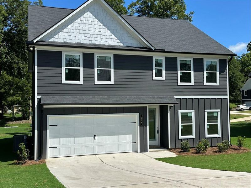 Front exterior of a new home in , Hoschton, GA, highlighting curb appeal (Image 2). Front exterior of a new home in , Hoschton, GA, highlighting curb appeal (Image 2).