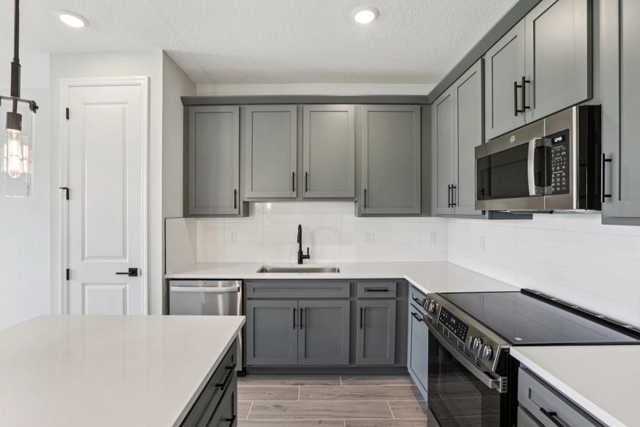 Spacious kitchen layout featuring AW Collection® Minimalist - Representative images and renderings are for illustrative purposes