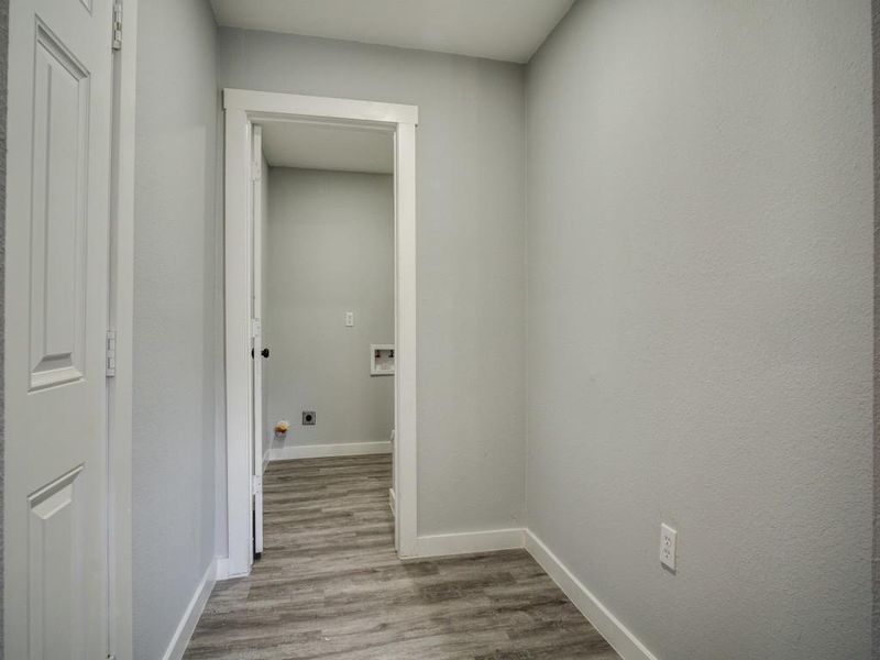 Hall featuring wood-type flooring Hall featuring wood-type flooring