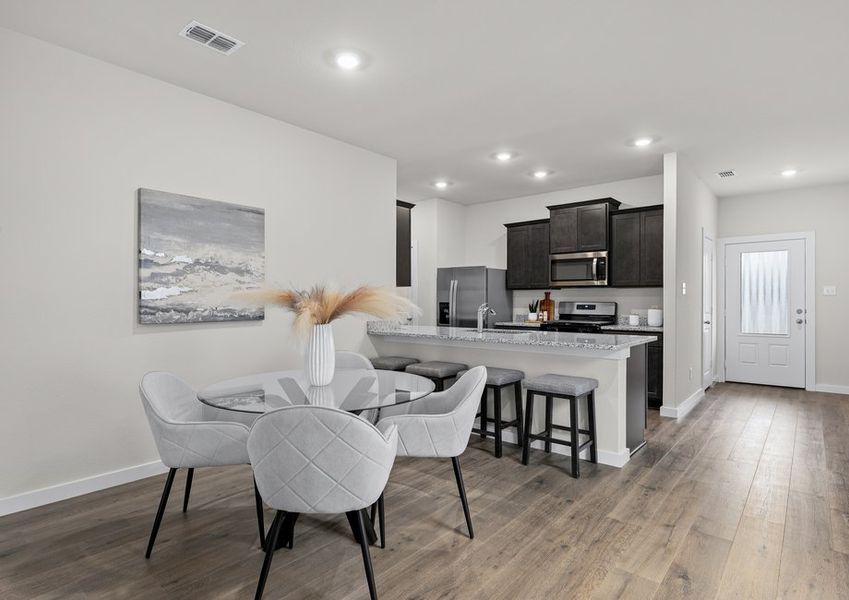 The dining room sits right off of the kitchen. The dining room sits right off of the kitchen.