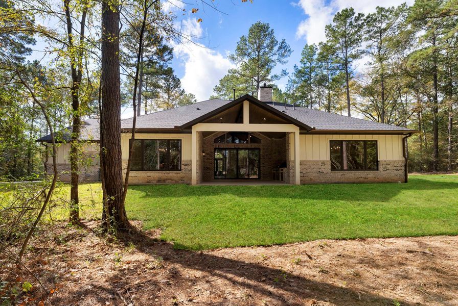 Exterior details and patio area of a home in , New Waverly (Image 31). Exterior details and patio area of a home in , New Waverly (Image 31).