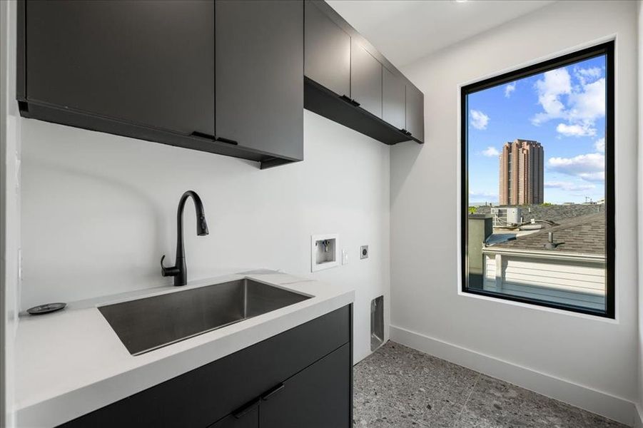 Laundry room located on the 3rd floor with cabinet space, hookup for a washing machine, and hookup for an electric dryer Laundry room located on the 3rd floor with cabinet space, hookup for a washing machine, and hookup for an electric dryer