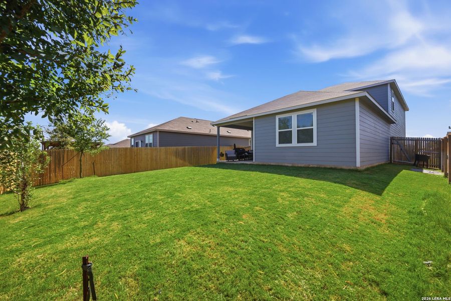 Exterior details and patio area of a home in Millican Grove, Converse (Image 26).
