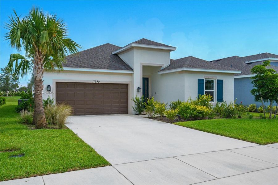 Front exterior of a new home in , Port St. Lucie, FL, highlighting curb appeal (Image 2). Front exterior of a new home in , Port St. Lucie, FL, highlighting curb appeal (Image 2).
