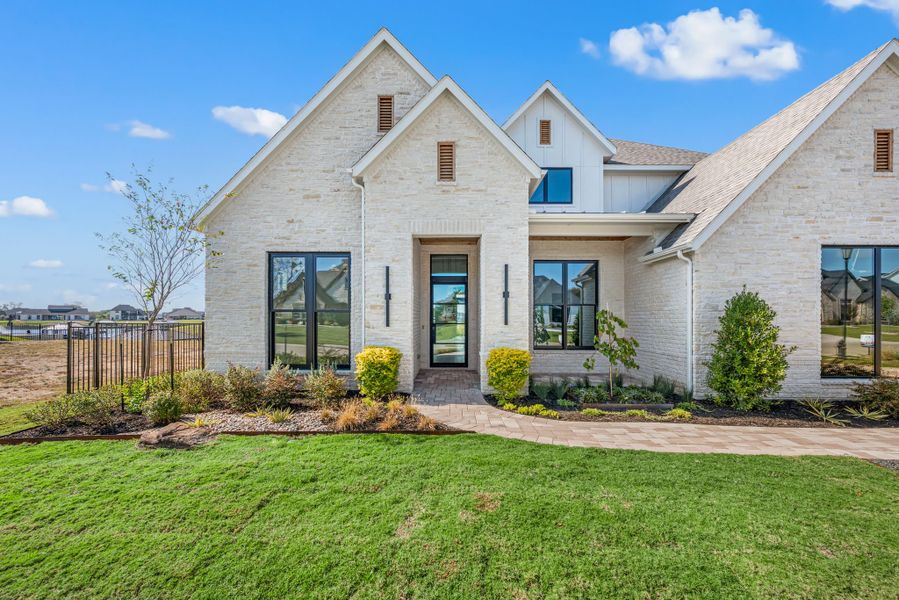 Front exterior of a new home in The Resort on Eagle Mt. Lake, Fort Worth, TX, highlighting curb appeal (Image 29).