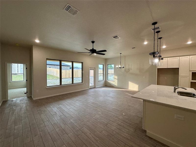 Unfurnished living room featuring recessed lighting, wood finished floors, and ceiling fan