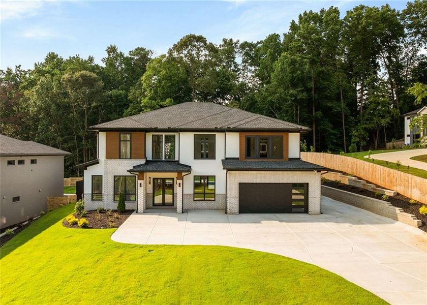 Front exterior of a new home in , Sugar Hill, GA, highlighting curb appeal (Image 34). Front exterior of a new home in , Sugar Hill, GA, highlighting curb appeal (Image 34).