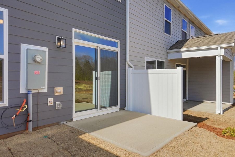 Exterior details and patio area of a home in Blythe Mill Townhomes, Waxhaw (Image 4). Exterior details and patio area of a home in Blythe Mill Townhomes, Waxhaw (Image 4).