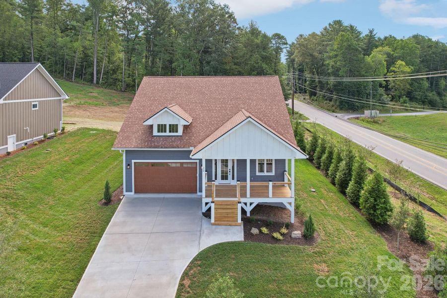 Front exterior of a new home in , Hendersonville, NC, highlighting curb appeal (Image 20).