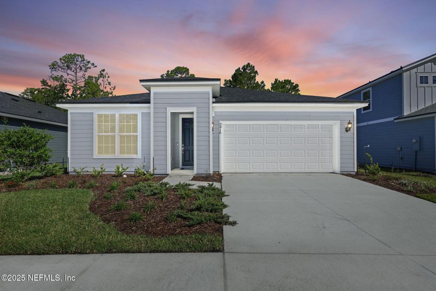 Front exterior of a new home in Bradley Creek, Green Cove Springs, FL, highlighting curb appeal (Image 1).