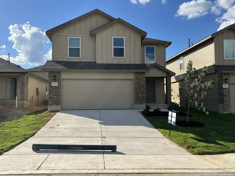 Front exterior of a new home in Applewood, San Antonio, TX, highlighting curb appeal (Image 1). Front exterior of a new home in Applewood, San Antonio, TX, highlighting curb appeal (Image 1).
