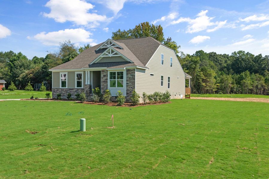 Front exterior of a new home in Redland, Advance, NC, highlighting curb appeal (Image 2). Front exterior of a new home in Redland, Advance, NC, highlighting curb appeal (Image 2).