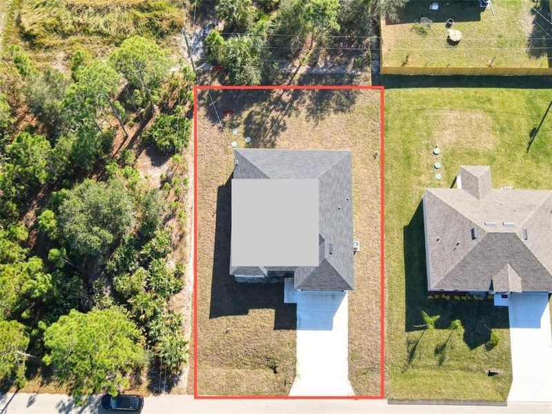 Front exterior of a new home in , Palm Bay, FL, highlighting curb appeal (Image 2).